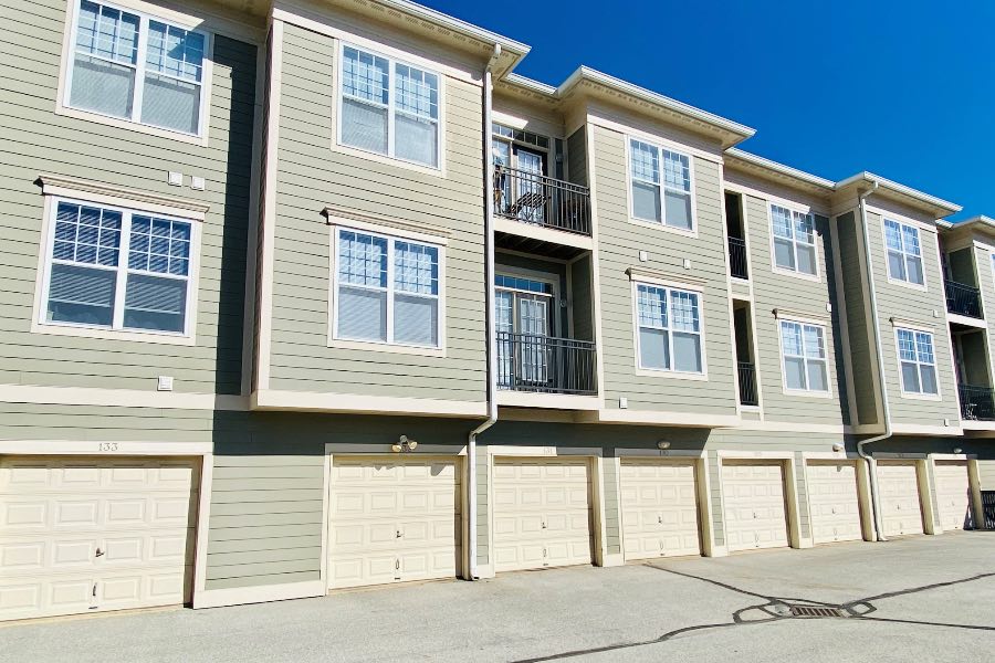 Enjoy added convenience, security, and weather protection with an attached garage like the ones seen here at The Waverley in Indianapolis. Single-car attached garages at apartment building